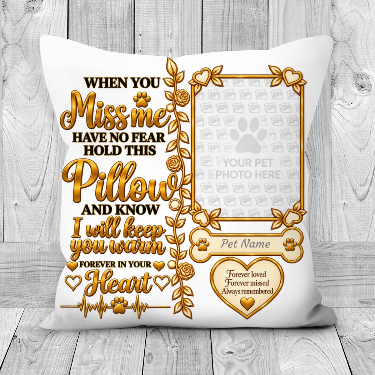 A square white pet memorial pillow with a gold and black printed design, featuring a photo frame placeholder, the text 'When you miss me have no fear hold this pillow and know I will keep you warm forever in your heart,' and a heart-shaped area that reads 'Forever loved forever missed Always remembered.' The pillow is shown against a light gray wood plank background.