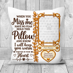 A white pet memorial throw pillow with brown and gold printed text and a photo frame design, displayed against a light gray wood plank background.