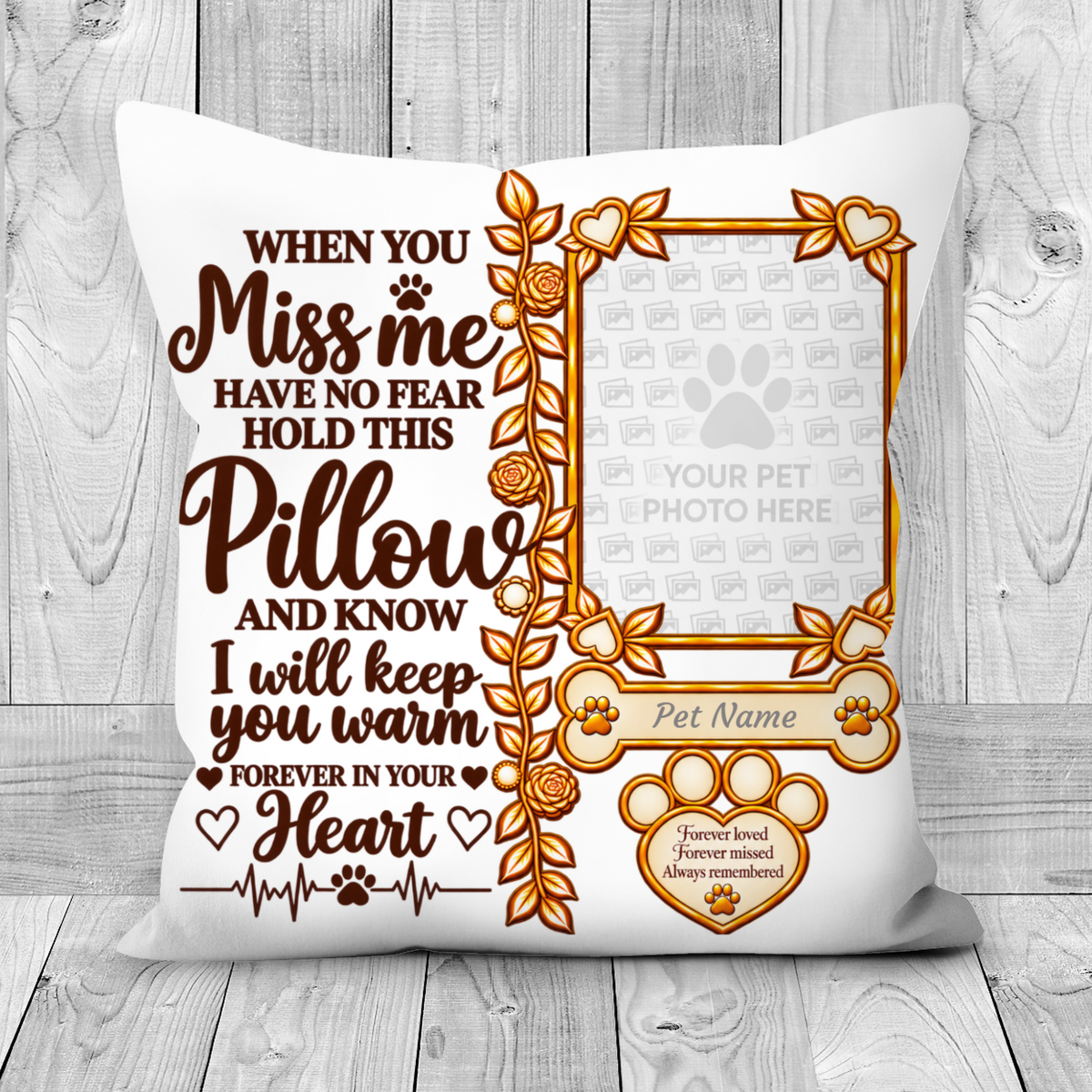 A square white pet memorial pillow with a warm brown and gold printed design, displayed on a light gray wood plank background. The design features a photo frame placeholder, paw prints, and comforting text that reads 'WHEN YOU Miss me HAVE NO FEAR HOLD THIS Pillow AND KNOW I will keep you warm FOREVER IN YOUR Heart'.
