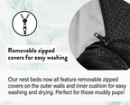 Dog nest bed with removable zipped cover on a light blue background