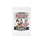 A rectangular white blanket or mat with rounded corners, featuring a printed graphic of a brown and white dog with the text